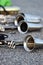 Bass clarinets on pavement, horn close-up