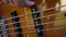 Bass guitar player close up playing virtuoso bass with fingers