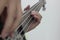 Bassist`s fingers with white background