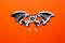 Bat-mask and vampire fangs on an orange background.