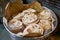 Batch of chapati round flatbreads in bucket for langar in sikh gurudwara temple, roti flatbreads