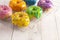 A Batch of Rainbow Donuts on a White Wood Table