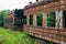 A batch of rusty train carriages abandoned in the forest