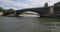 Bateau-mouche passing under the Pont de Sully in Paris