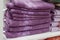 Bath accessories. A stack of new towels. Textile industry. Retail trade