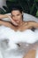 Bath and Body Care Treatment of Spa Woman in Bathtub, Tropical Relax