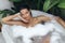 Bath and Body Care Treatment of Spa Woman in Bathtub, Tropical Relax