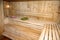 Bath house wooden room with broom grass and towel