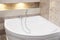 Bath jacuzzi in modern bathroom in apartment