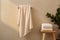 Bath towel hanging on the wall, chair with towel