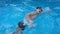 Bathe in the pool water. kids children boy and girl swimming in the pool playing slow motion video