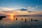 Bather`s silhouettes at sunset in Lake Balaton, Hungary