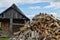 Bathhouse. In foreground is woodpile of birch firewood