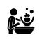 Bathing child black glyph icon