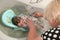 Bathing a newborn at home. A picture of a newborn baby from the first bathroom