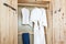 Bathrobe and shirt, pants in wooden wardrobe