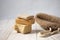 Bathroom accessories. brown washcloth and pieces of soap on a light background.