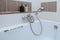 Bathroom bidet faucet closeup as background