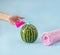 Bathroom creative concept. Watermelon Summer soap for hands and pink towel. Wash your hands. Pastel blue background