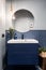 Bathroom with dark blue cabinet