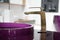 Bathroom detail in new luxury home: sink and golden faucet.