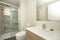 Bathroom with elongated white porcelain sink, rectangular frameless