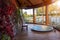 Bathroom with glass windows and pond views