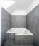 Bathroom with grey tiles in a small apartment