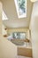 Bathroom with high vaulted ceiling and skylight