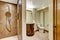 Bathroom interior with carved wood vanity cabinet