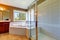 Bathroom interior with corner bath tub and screened shower