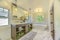 Bathroom interior with marble flooring and bathtub adjacent to the vanity area