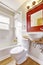 Bathroom interior. with Red cabinet and white vessel sink
