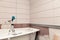 Bathroom interior repair, laying tiles on walls