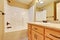 Bathroom interior. Single sink vanity and shower bathtub.