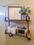 Bathroom interior with two layer shelf mounted on the plain white wall