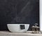 Bathroom interior with a white bathtub, dark marble wall and wooden floor. 3D render.