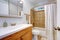 Bathroom interior with wooden vanity cabinet