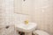 Bathroom with kitsch fixtures and tiles, white sink