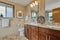 Bathroom with large vanity, mirror and granite countertop