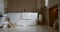 Bathroom tiled with marble tiles in different shades of brown