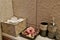 Bathroom with towels, flowers and care creams