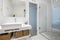 bathroom with white porcelain fixtures white tiled walls and marble