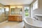 Bathroon with vanity cabinet and shower area with glass doors