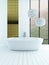 Bathtub standing in front of golden tiled wall