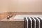 Bathtub, striped towel and candle lights