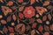 Batik textile pattern with black and red