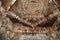 Bats are sitting on the ceiling of a Hindu temple. Prasanna Virupaksha temple is also known as the Underground Shiva Temple in Ham