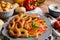 Batter fried squid rings with potato croquettes and pepper salad