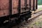 Battered railway wagon standing on the tracks